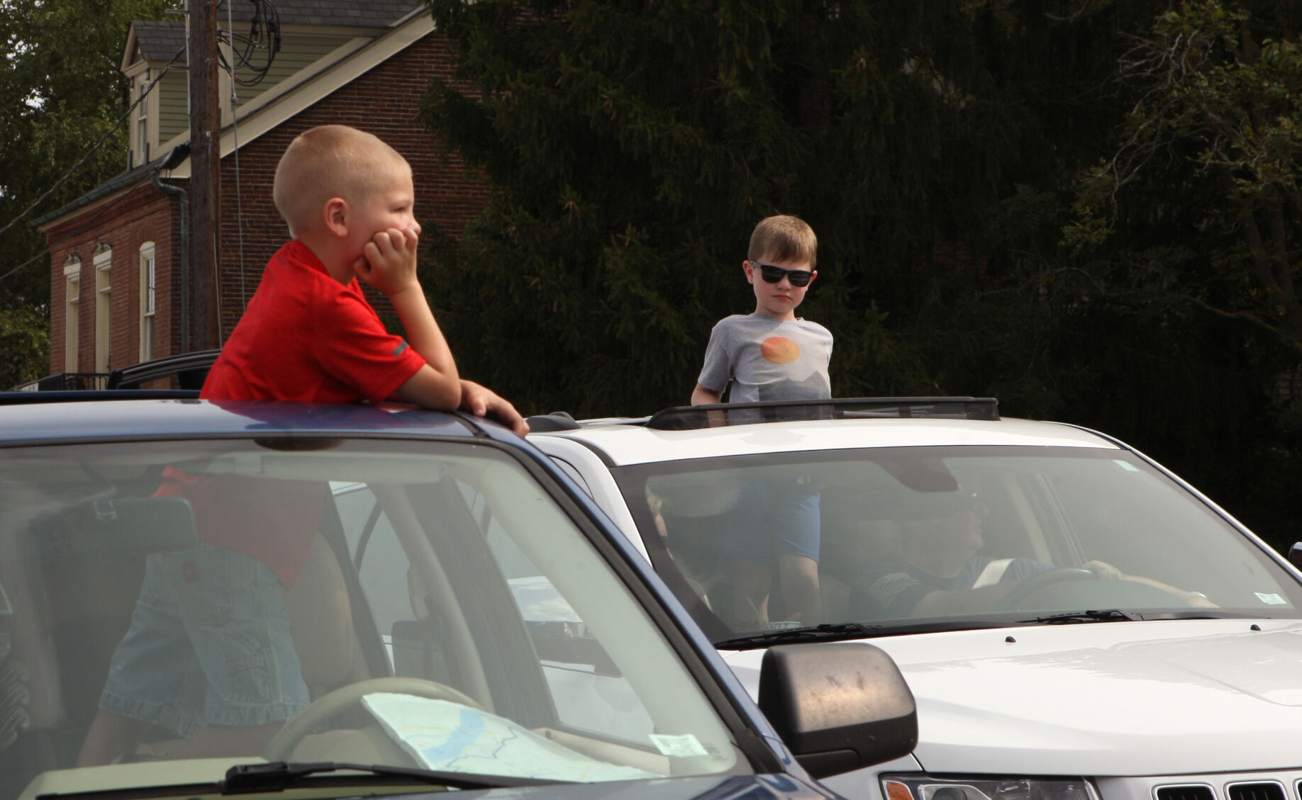 Mason Derner and Drew Thornton look out the sunroof